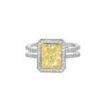 Engagement ring featuring a yellow emerald-cut diamond accented by round white diamonds.
